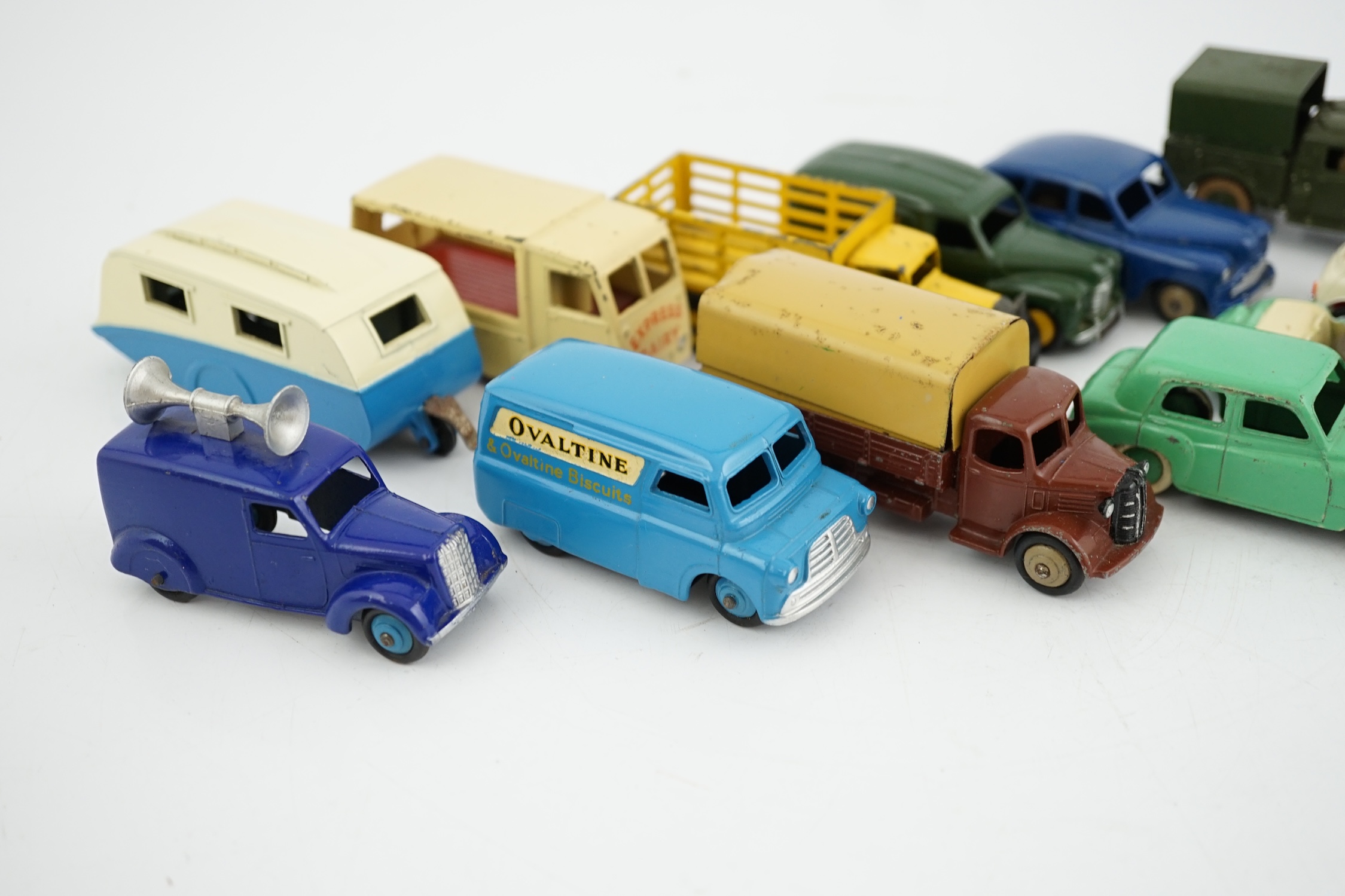 Twelve Dinky Toys, including; Austin van, Vanguard, Market Gardener’s wagon, Hillman Minx, MG Midget, Bedford van, etc.